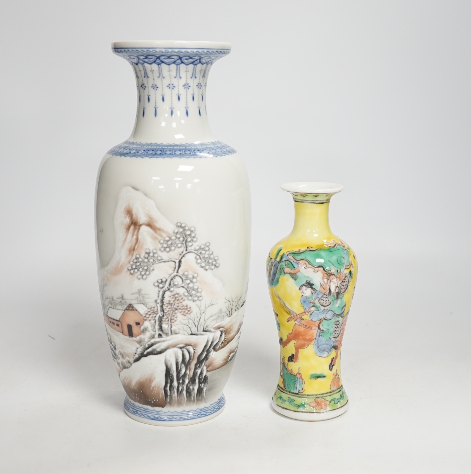 A Chinese Republic period enamelled porcelain ‘winter scene’ vase, and a yellow ground ‘warriors’ vase, largest 24cm high